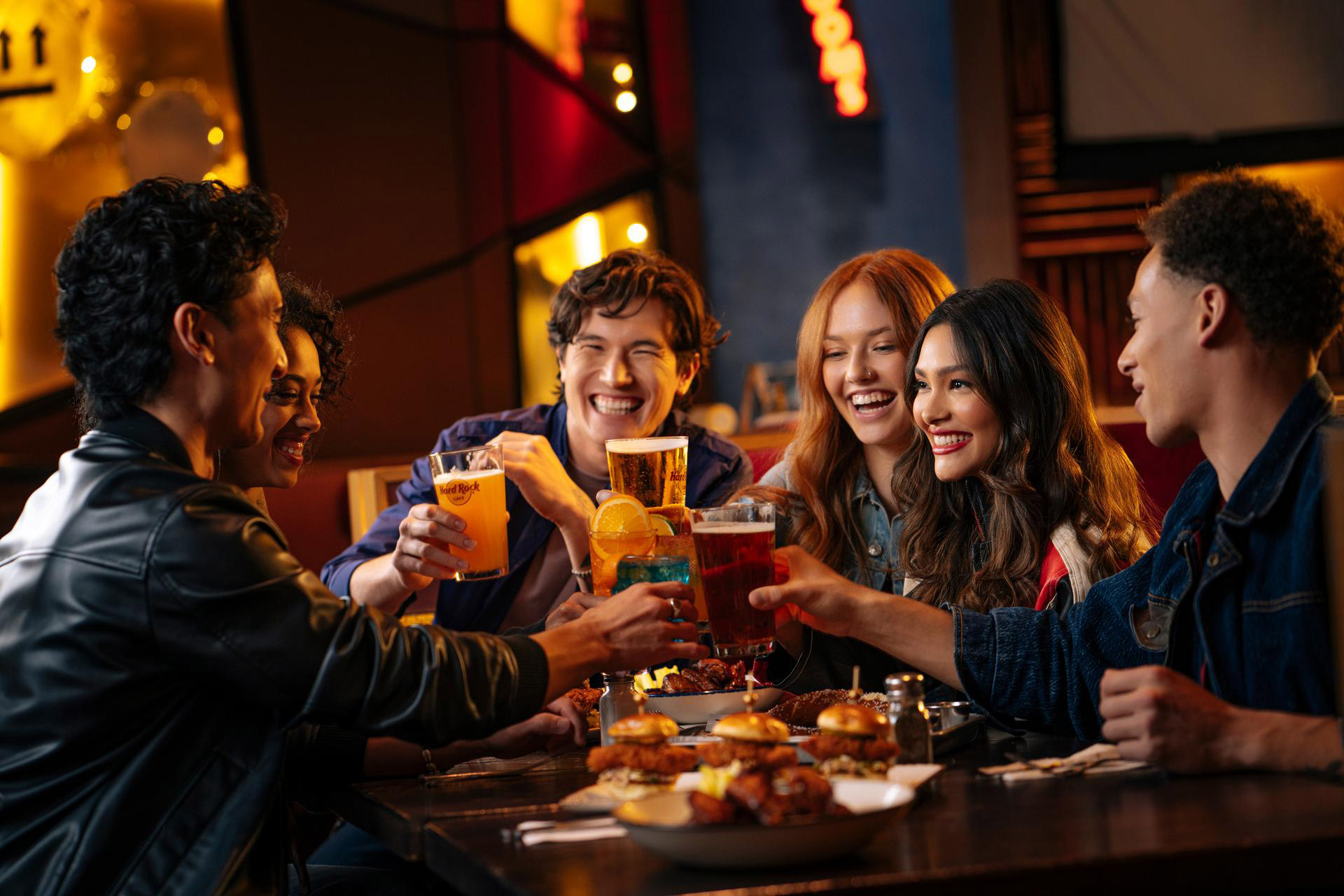 a group of people sitting at a table with drinks