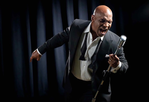 Mike Tyson yelling into microphone