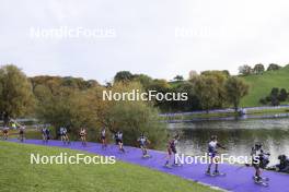 19.10.2025, Munich, Germany (GER): Lou Jeanmonnot (FRA), Lisa Vittozzi (ITA), Anna Magnusson (SWE), Suvi Minkkinen (FIN), Karoline Offigstad Knotten (NOR), Milena Todorova (BUL), Johanna Skottheim (SWE), Lea Meier (SUI), Anna Gandler (AUT), Aita Gasparin (SUI), Anna Weidel (GER), Maya Cloetens (BEL), Lotte Lie (BEL), Lara Wagner (AUT), Jeanne Richard (FRA), (l-r) - Loop One Biathlon Opening Festival - Munich (GER). www.nordicfocus.com. © Manzoni/NordicFocus. Every downloaded picture is fee-liable.