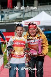 27.08.2025, Oberstdorf, Germany (GER): Mara Haefner (GER) winner of Youth Cup, Nathalie Armbruster (GER), (l-r) - FIS Nordic Combined Summer Grand Prix men and women, compact HS137, Oberstdorf (GER). www.nordicfocus.com. © Volk/NordicFocus. Every downloaded picture is fee-liable.